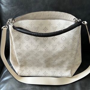 Authentic Louis Vuitton Mahina Babylone bag in ivory.